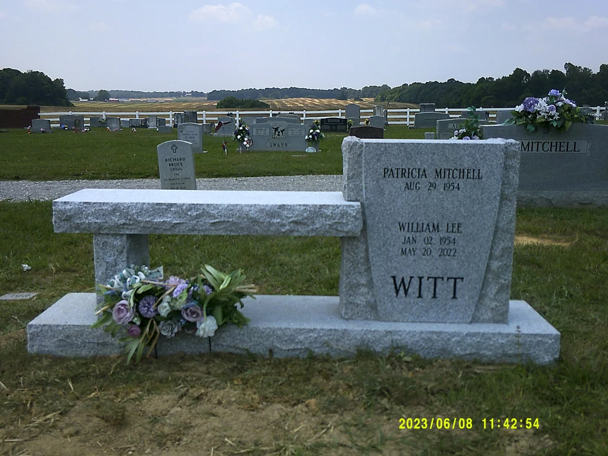 A granite bench joined to a vertical Witt inscription stone