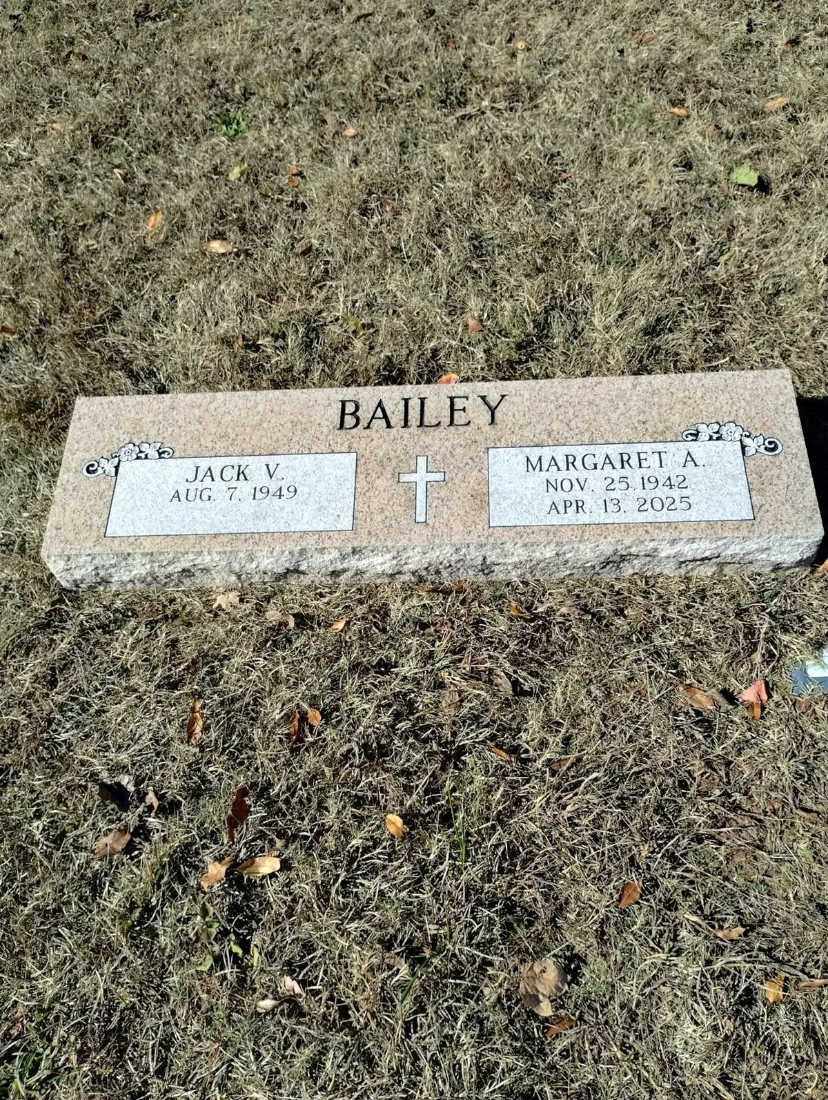 A low companion marker for the Bailey family, with two inscription panels and a shared family name