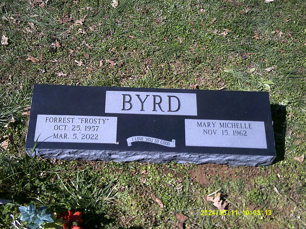 The Byrd low black companion marker with two pale inscription panels and a shared family name